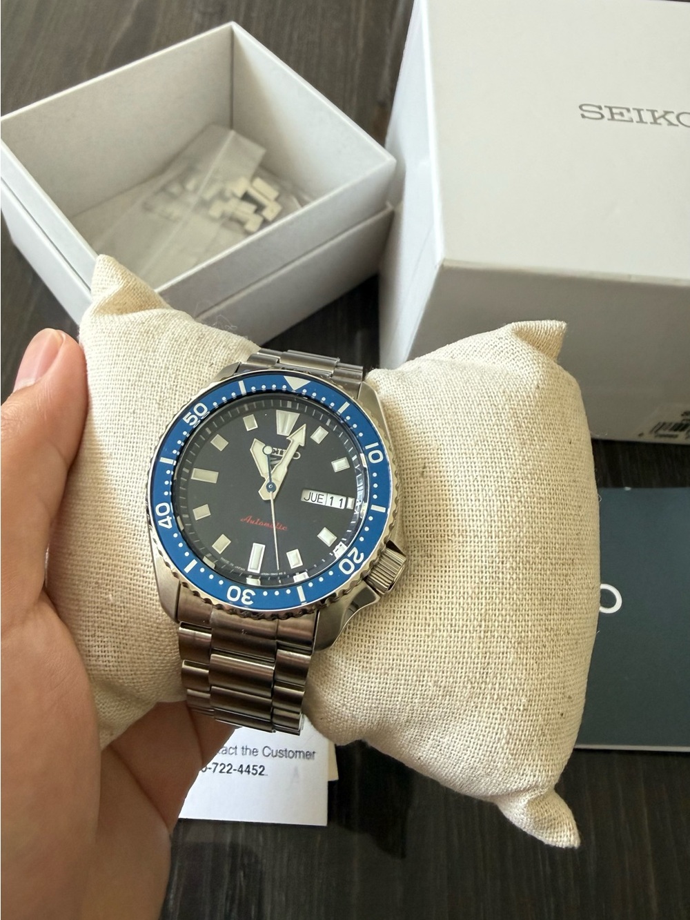 Seiko 5 Sport Silver Stainless Steel Watch with Blue Bezel and Black Dial